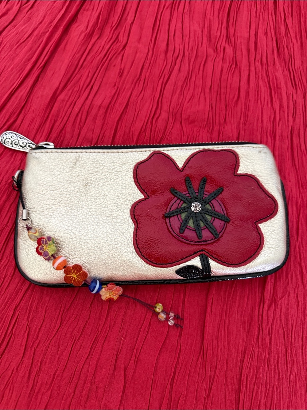 Brighton gold Wristlet with Red Flower Appliqué and Beaded Charm